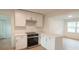 Modern kitchen with white shaker cabinets, stainless steel appliances, and quartz countertops at 106 Reardon Ave, Walterboro, SC 29488