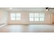 Spacious living room with large windows and hardwood floors at 106 Reardon Ave, Walterboro, SC 29488