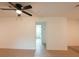 Open living room with light wood flooring and access to the bathroom at 106 Reardon Ave, Walterboro, SC 29488