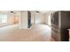 Bright living room featuring hardwood floors, a stone fireplace, and open concept floorplan at 106 Reardon Ave, Walterboro, SC 29488