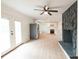 Open living room with kitchen views, fireplace, and hardwood floors at 106 Reardon Ave, Walterboro, SC 29488