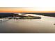 Aerial view of waterfront property at sunset at 122 Cainhoy Landing Rd, Charleston, SC 29492