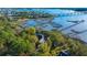 Waterfront home nestled amongst lush trees with private pier access at 122 Cainhoy Landing Rd, Charleston, SC 29492