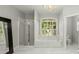 Bathroom with soaking tub, walk-in shower, and large window at 122 Cainhoy Landing Rd, Charleston, SC 29492