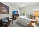 Comfortable guest bedroom with TV and sitting area at 122 Cainhoy Landing Rd, Charleston, SC 29492