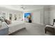 Spacious primary bedroom with water views, large TV, and ample closet space at 122 Cainhoy Landing Rd, Charleston, SC 29492