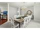 Formal dining room with chandelier and large windows at 122 Cainhoy Landing Rd, Charleston, SC 29492