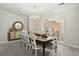 Formal dining room with large table, chandelier, and mirror at 122 Cainhoy Landing Rd, Charleston, SC 29492