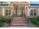 Brick entryway with stairs, porch, and lanterns at 122 Cainhoy Landing Rd, Charleston, SC 29492