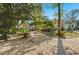 Brick home with walkway, landscaping, and large trees at 122 Cainhoy Landing Rd, Charleston, SC 29492