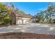 Three-car garage with circular driveway and ample parking space at 122 Cainhoy Landing Rd, Charleston, SC 29492