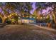 Brick house with screened porch at dusk at 122 Cainhoy Landing Rd, Charleston, SC 29492