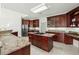 Island kitchen with stainless steel appliances and granite counters at 122 Cainhoy Landing Rd, Charleston, SC 29492