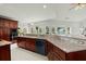 Spacious kitchen with granite countertops and dark wood cabinetry at 122 Cainhoy Landing Rd, Charleston, SC 29492