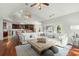 Living room boasts hardwood floors and comfy sectional sofa at 122 Cainhoy Landing Rd, Charleston, SC 29492