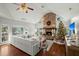 Open living area with fireplace and large windows at 122 Cainhoy Landing Rd, Charleston, SC 29492