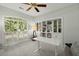 Home office with built-in shelving and window with shutters at 122 Cainhoy Landing Rd, Charleston, SC 29492