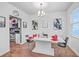 Bright dining room with white table and four black chairs, kitchen view at 126 Wild Holly Dr, Moncks Corner, SC 29461