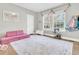 ' playroom with pink couch, rug and a cat tree at 169 Nettleswood Dr, Saint George, SC 29477