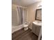 Clean bathroom with a tub shower and gray vanity at 1879 Hampton Ave, North Charleston, SC 29405