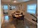 Dining room with wood table, gray chairs, and kitchen view at 1879 Hampton Ave, North Charleston, SC 29405