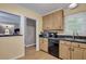 Kitchen with tan cabinets, stainless steel appliances, and granite counters at 1932 Sunnyvale Ave, Charleston, SC 29414