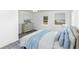 Spacious bedroom with hardwood floors and light blue bedding at 211 Water Wheel Rd, Ridgeville, SC 29472
