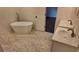 Modern bathroom with freestanding bathtub and double vanity at 220 Thompson St, Walterboro, SC 29488
