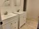 Updated bathroom with double vanity and modern fixtures at 220 Thompson St, Walterboro, SC 29488