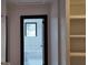 Clean bathroom with a toilet, bathtub and built-in shelving at 220 Thompson St, Walterboro, SC 29488