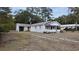 Charming bungalow with metal roof, newly landscaped yard and driveway at 220 Thompson St, Walterboro, SC 29488