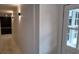 Bright hallway with wainscoting and access to kitchen at 220 Thompson St, Walterboro, SC 29488