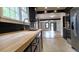 Renovated kitchen with butcher block countertops and stainless steel appliances at 220 Thompson St, Walterboro, SC 29488