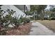 Landscaped front yard with shrubs and walkway at 220 Thompson St, Walterboro, SC 29488