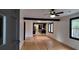 Hardwood floors and an open concept living area with kitchen view at 220 Thompson St, Walterboro, SC 29488