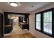 Hardwood floors and an open concept living area with kitchen view at 220 Thompson St, Walterboro, SC 29488