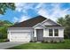 Craftsman style home with white siding, stone accents, and a two-car garage at 244 Mcmakin Dr, Summerville, SC 29483