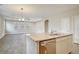 Open kitchen features an island with a sink and granite countertops at 244 Mcmakin Dr, Summerville, SC 29483