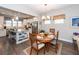Open concept kitchen and dining area with granite counters and stainless steel appliances at 443 Switchgrass Dr, Summerville, SC 29486