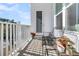 Peaceful balcony with metal bench and potted plants at 814 Kings Oak Ct # 2, Charleston, SC 29492