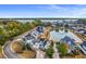 Aerial view of a house in a neighborhood near a pond and waterway at 1007 Jervey Point Rd, Wando, SC 29492