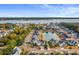 Aerial view of a house in a neighborhood near a pond and waterway at 1007 Jervey Point Rd, Wando, SC 29492