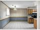 Simple dining area with tile floor and wood-paneled walls at 107 Pinewood St, Ladson, SC 29456