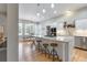 Spacious kitchen with island, stainless steel appliances, and white cabinets at 1129 Plantation Overlook Dr, Moncks Corner, SC 29461