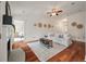 Living room with hardwood floors, a fireplace and view into bedroom at 116 Hearthstone Cir, Goose Creek, SC 29445