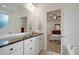 Bathroom features granite countertop, double vanity, and a view of the bedroom at 119 Osage Way, Summerville, SC 29483