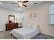 Bright bedroom with ceiling fan, dresser, and a queen-size bed at 119 Osage Way, Summerville, SC 29483