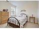 Cozy bedroom with a metal bed frame, dresser, and window at 119 Osage Way, Summerville, SC 29483