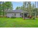 Gray house exterior with a covered patio and fenced yard at 119 Osage Way, Summerville, SC 29483