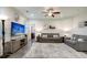 Living room with gray sofas, TV, and area rug at 119 Osage Way, Summerville, SC 29483